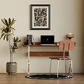 Home Office Desk With Laptop Books Chair Green Plant Wall Art And Round Rug