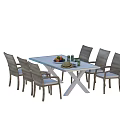 Outdoor Table With White Tabletop X Legs Six Gray Woven Chairs Holding Fruits And Drinks