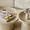 Elegant Modern Beige Round Coffee Tables With Tray Glass Cups Fruit And Flower Vase