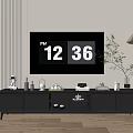 Modern Dark TV Stand With TV Decorative Items Floor Lamp And Green Plant