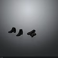 Fashionable Black Short Boots With Zipper Design And Worn Pair Showcase