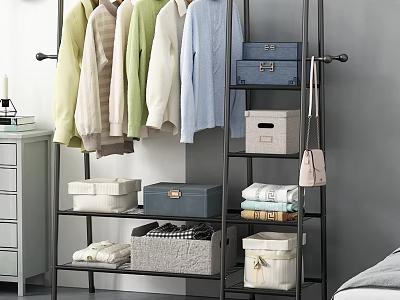 Organized Clothes Hanging On Metal Rack With Storage Boxes Baskets And Folded Items 3d model