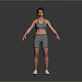 Woman in Gray Sports Bra and Shorts Standing with White Sneakers on Gray Background