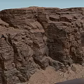 Natural Garden Landscape With Reddish Brown Layered Rocks Gravel Sand And Blue Sky