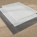 Three Stacked Square Rugs in Gray and White with Woven Texture on Wooden Floor