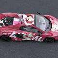 Pink Sports Car With Vibrant Anime Character Art On Exterior