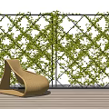 Lush Green Vines Growing On Lattice Wall With Woven Rattan Chair And Wooden Floor