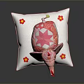 Pink Patchwork Elephant Toy Standing On White Pillow With Flower Decorations And Red Ribbons