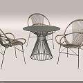 Modern Minimalist Table and Chair Set with Round Dark Tabletop Woven Seats and Metal Frame