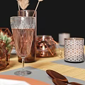 Elegant Dining Table Setup With Leaf Pattern Plates Copper Cutlery And Glass Cups