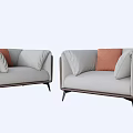 Stylish Modern Single Seater Sofa With Light Gray Upholstery Brown Trim And Orange Pillows