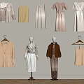 Trendy Beige White And Brown Fashion Outfits On Mannequins Hangers Against Neutral Wall