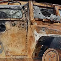 Rusted Military Vehicle With Open Door Damaged Body And Worn Rusty Exterior