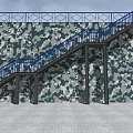 Outdoor Metal Staircase Featuring Blue Railings And Camouflage Patterned Wall Design