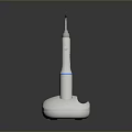 White Electric Toothbrush With Blue Ring And Silver Brush Head On Modern Base