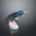 Blue And White Ceramic Kingfisher Figurine With White Base On Black Background
