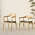 Modern Wooden Dining Table with Chairs Black Cushions Vase Magazines and Fruit Plate