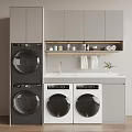 Front Load Stackable Washing Machines In Modern Laundry Room With Grey Cabinets And Sink Counter