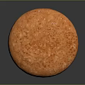 Round Orange Baked Pastry With Speckled Sugar Topping On Surface