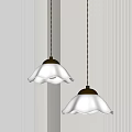 Two White Petal shaped Pendant Lights with Gold Bases in Minimalist Interior Setting