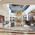 Modern Shopping Mall Lobby Interior With Hanging Chandelier Escalator And Shop Windows