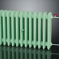 Green Cast Iron Radiator With Red Valves And Multiple Heat Fins On Dark Background