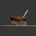 Creamy Soup in Pastry Crust Bowl on Woven Mat with Wooden Spoon