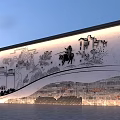 Traditional Building Exterior Wall With Illuminated Mural Of Horseback Figure And Historic Structures