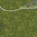 Scenic Park Landscape With Neatly Arranged Trees Large Rocks Green Lawns And Paved Paths