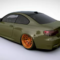 Green BMW Two Door Coupe With Orange Wheels And Sporty Exterior Design