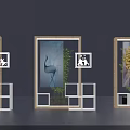 Display Shelves with Framed Decorative Artworks Green Plants and Geometric White Shelves on Dark Background