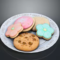 Colorful Decorated Cookies On Ceramic Plate With Sugar Flowers And Chocolate Chips