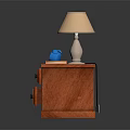 Wooden Bedside Table Interior With Table Lamp Blue Alarm Clock And Pink Book