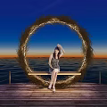 Garden Landscape With Circular Straw Ring Wooden Bench And Seaside Sunset View