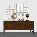 Wooden Console Table With Circular Panels Drawers Decorative Vases Dried Plants And Botanical Wall Art