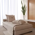 Beige Chaise Lounge With Pillows And Blanket Near White Curtains Green Plant And Wooden Wall