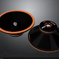 Modern Black And Orange Circular Electronic Speakers With Stylish Design