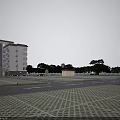Modern Mid Rise Residential Building with Large Windows Brown Roof Lawn Shrubs and Parked Cars