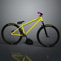 Bright Yellow Bicycle with Pink Handlebars and Maxxis Tires on Gray Surface