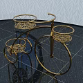 Golden Metal Tricycle Shaped Decorative Ornament Set With Intricate Baskets On Black Glossy Floor