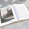 Open Hardcover Book Pages Featuring City Street Photograph And Text Content