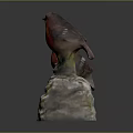 Red Bird Figurines Perched On White Base With Green Moss