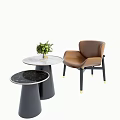 Elegant Modern Table And Chair Set With Round Marble Top And Brown Leather Chair