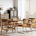 Modern Wooden Dining Table Set With Rattan Back Chairs Yellow Cushions And Potted Plant