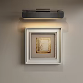 Light Colored Abstract Painting With White Frame Golden Border Illuminated By Black Wall Light Fixture