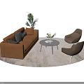 Brown Two Seater Sofa With Armchairs Coffee Table And Green Plants On Light Rug