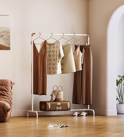 Brown Casual Clothes Of Different Styles Hanging On Metal Clothes Rack 3d model