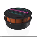 Circular Component With Black Outer Shell Colored Stripes And Orange Base