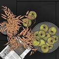Green Apples in Bowl with Golden Leaves on Dark Tiles Background