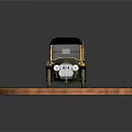 Vintage Classic Car with Black Top on Circular Display Platform with Stone Tiles and Grass
